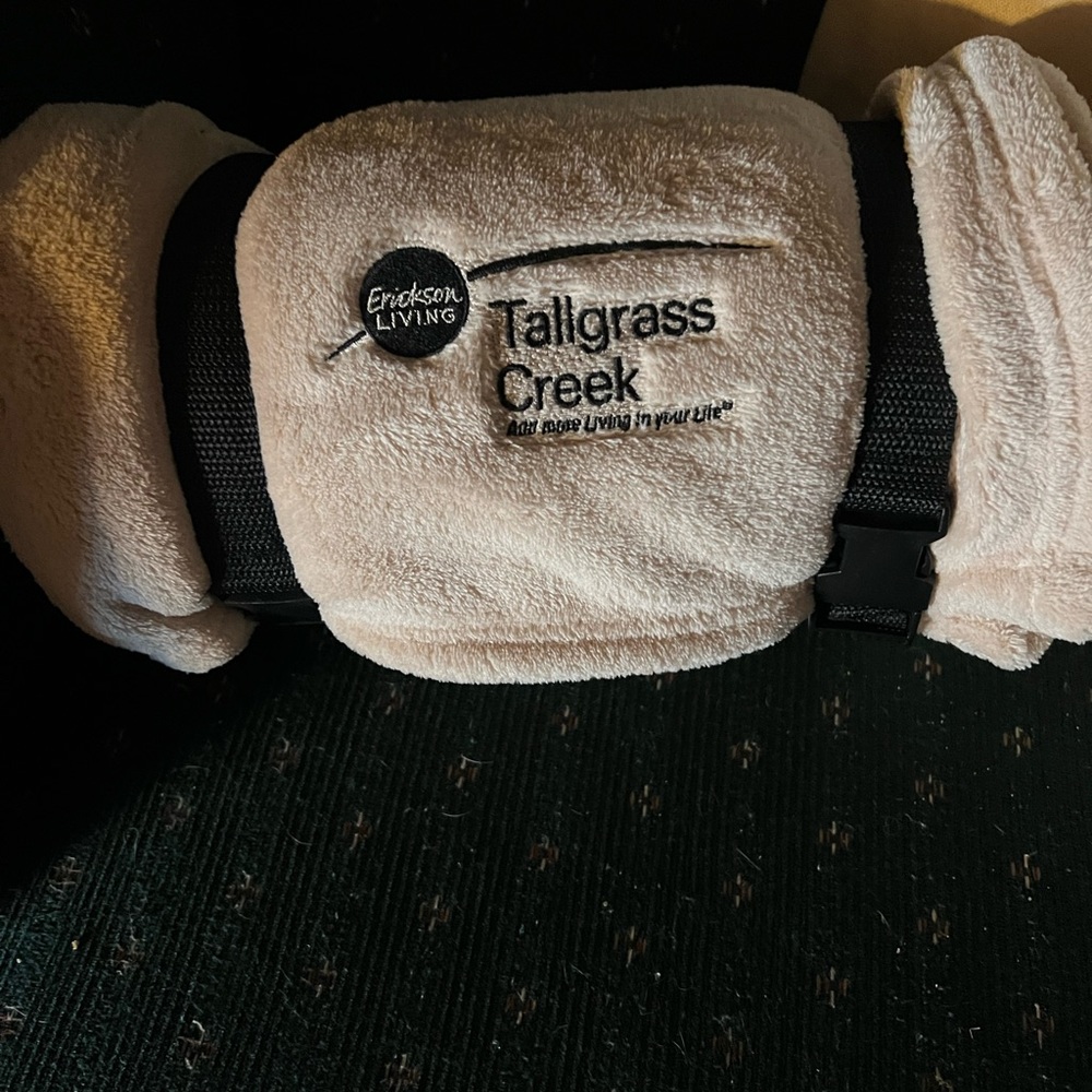 Blanket with logo.   Good for travel included carry strap NWT